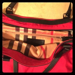 Burberry Red  weatherproof bag , zippered .